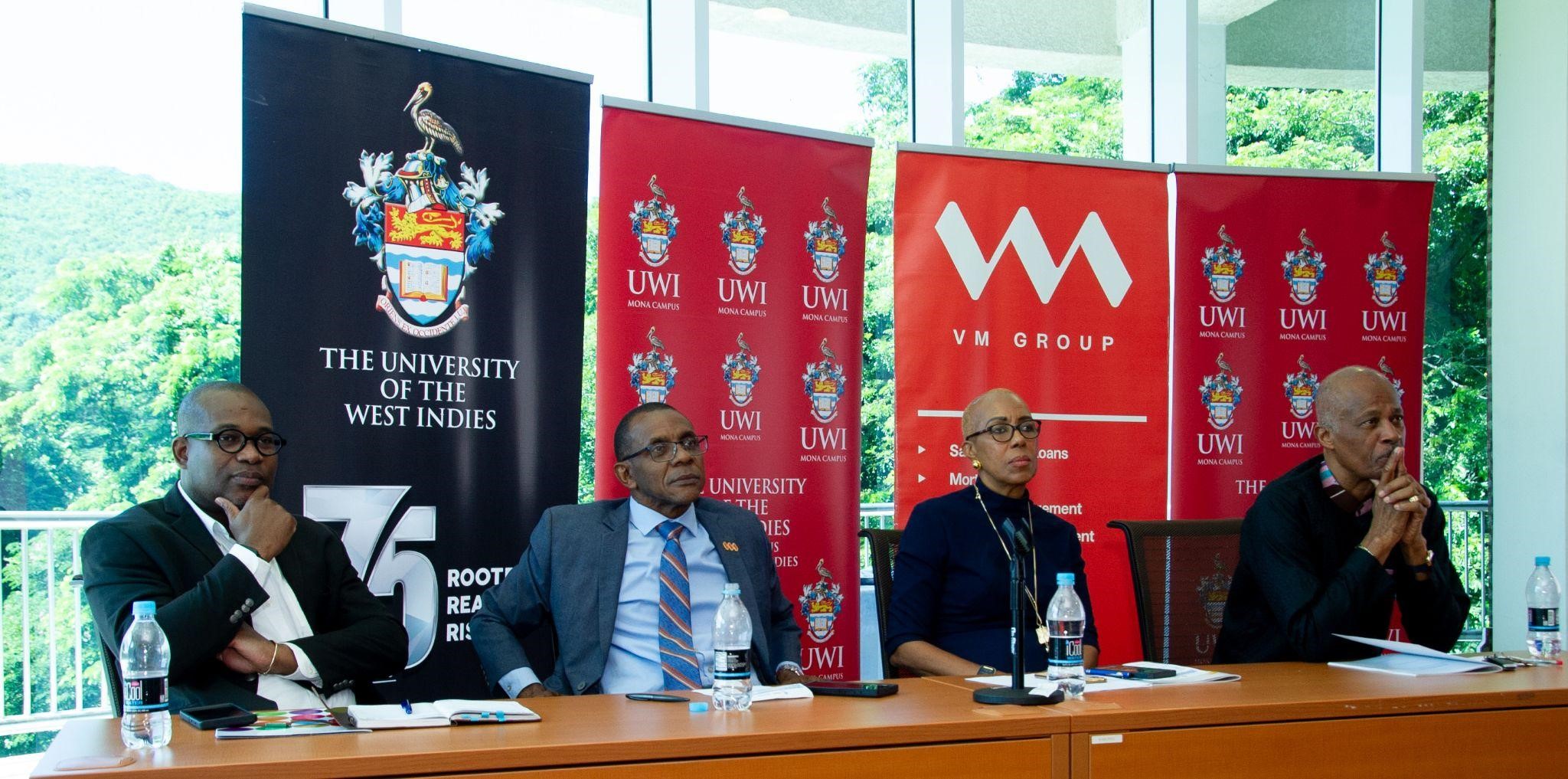 (L-R) Professor Densil A. Williams, Pro Vice-Chancellor and Principal of The UWI, Mona; Mr. Courtney Campbell, President and Chief Executive Officer of the VM Group; Hon. Fayval Williams, Minister of Education and Youth; and Professor Sir Hilary Beckles, Vice Chancellor, The UWI - all engage with guests, attentively absorbing their insights at the Colloquium on Financing Tertiary Education on Wednesday, October 11, 2023.